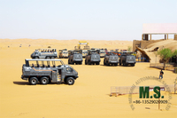 //imrorwxhonmplr5p-static.micyjz.com/cloud/lkBpiKoklrSRiljnpjljjo/desert-cruiser-bus-in-tourism-area.jpg